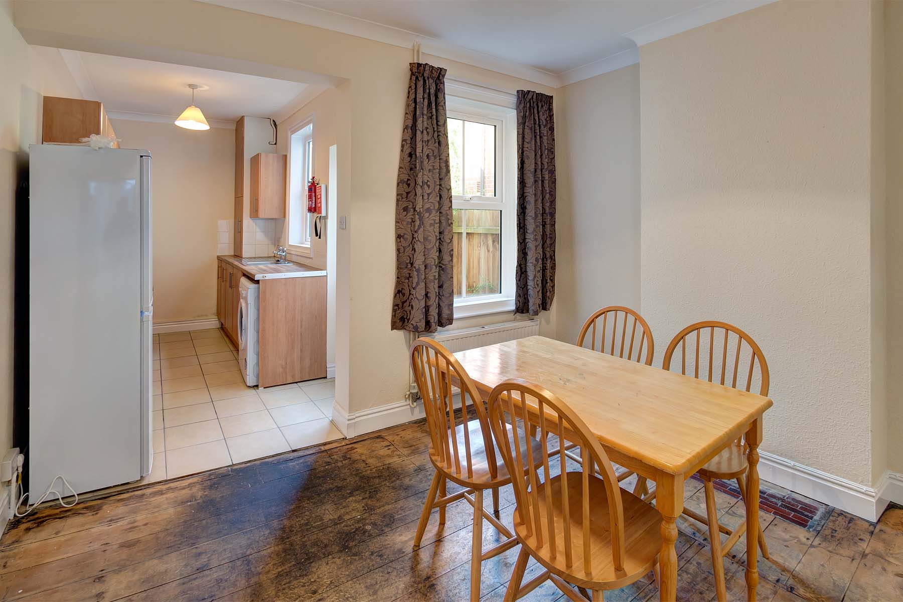 Open plan kitchen and dining area with dining table set
