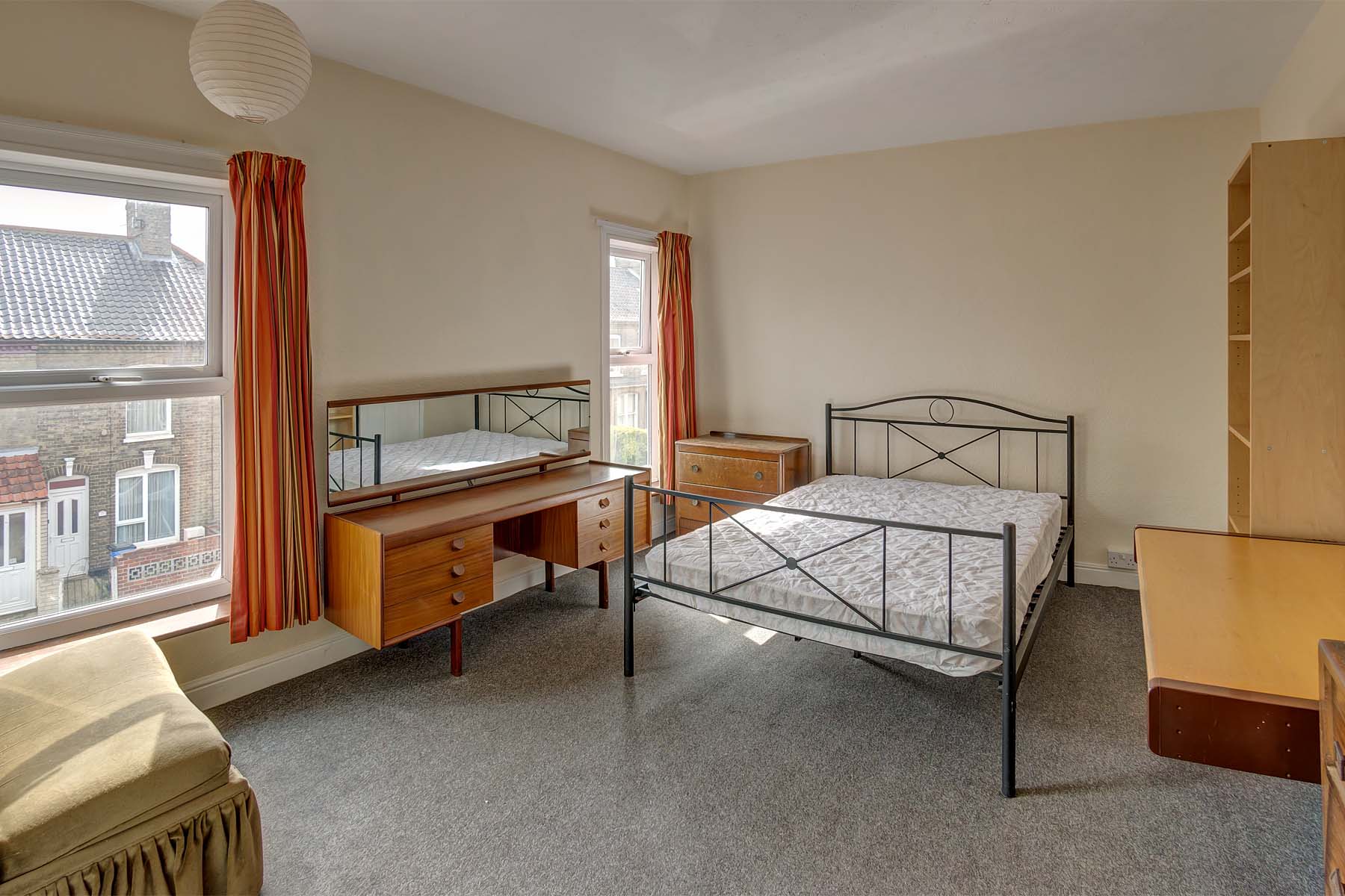 Bedroom with double bed and wooden furnishings