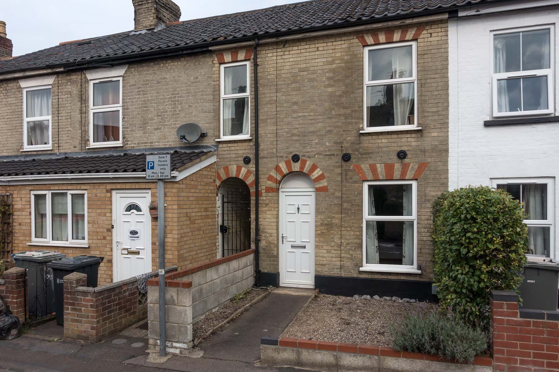 Brick terraced house with white door