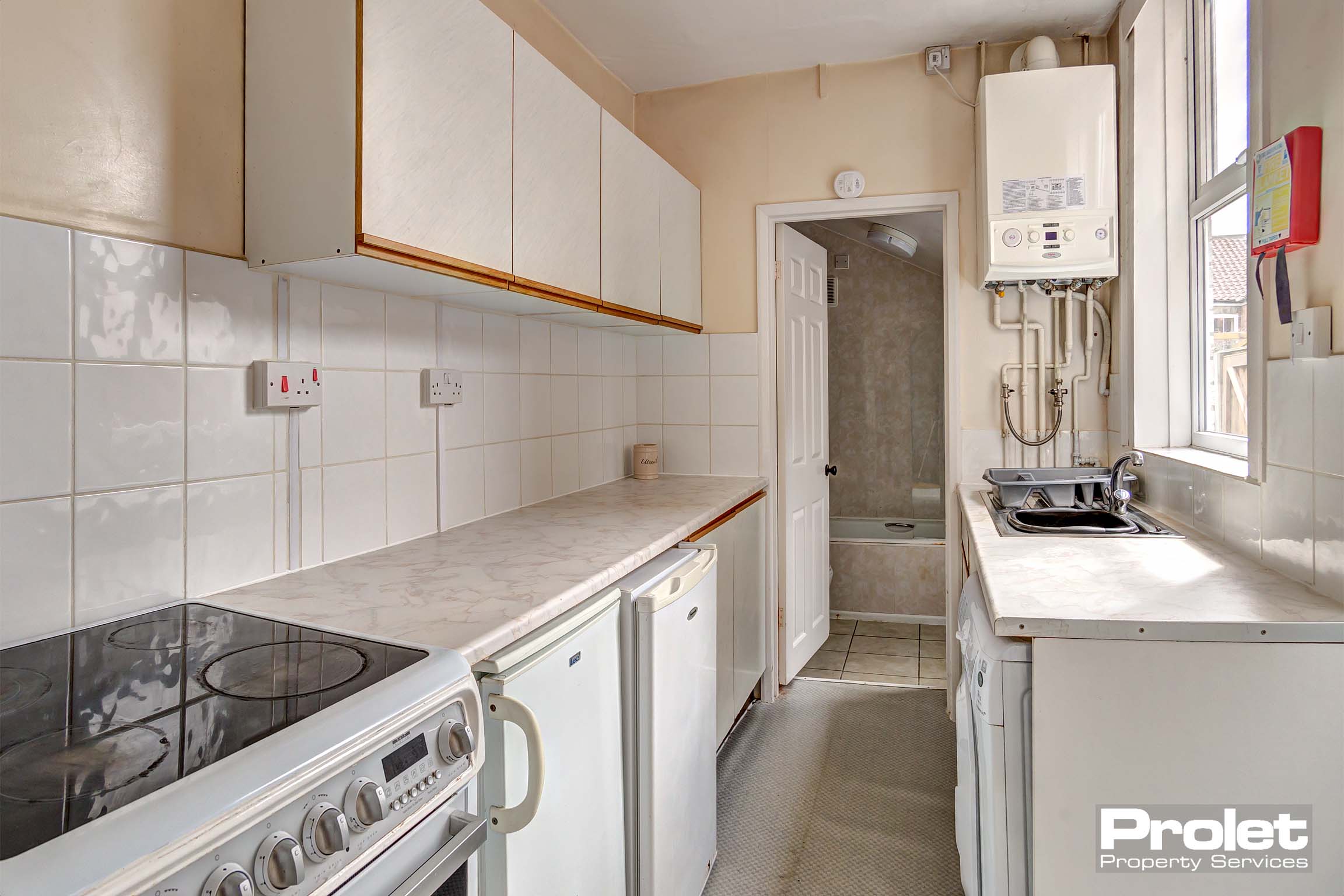 White galley style kitchen
