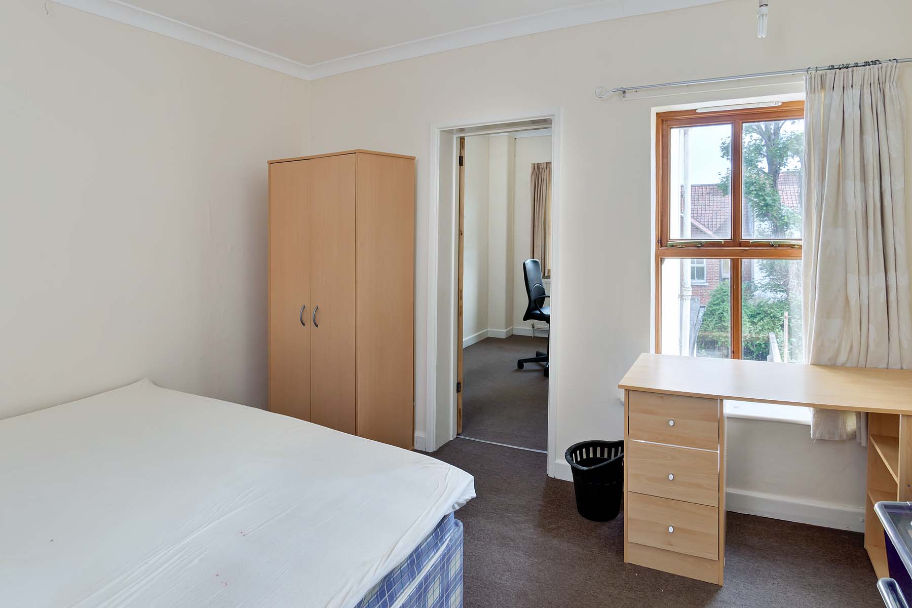 Bedroom with double bed and study