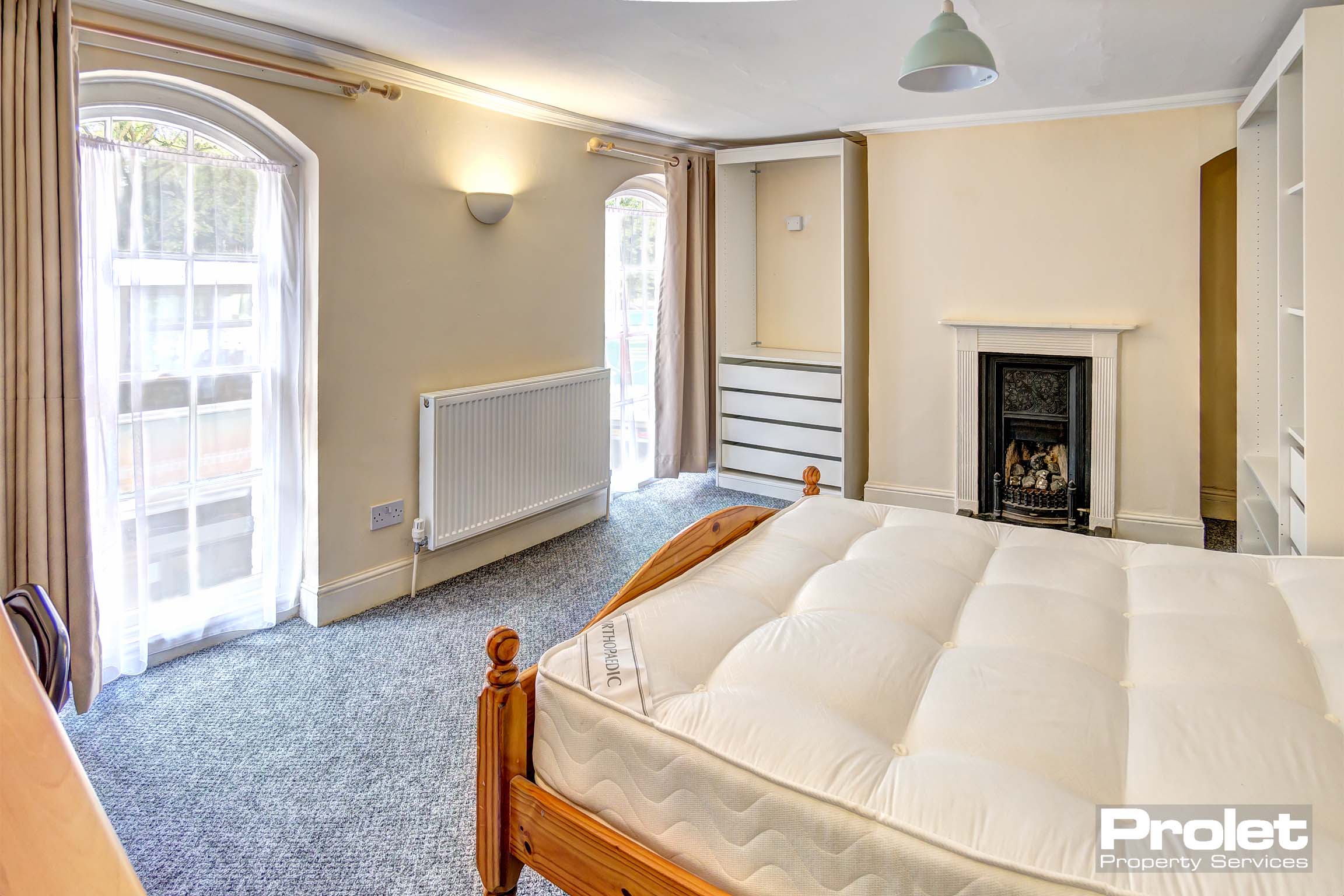 Large double bedroom with period fireplace