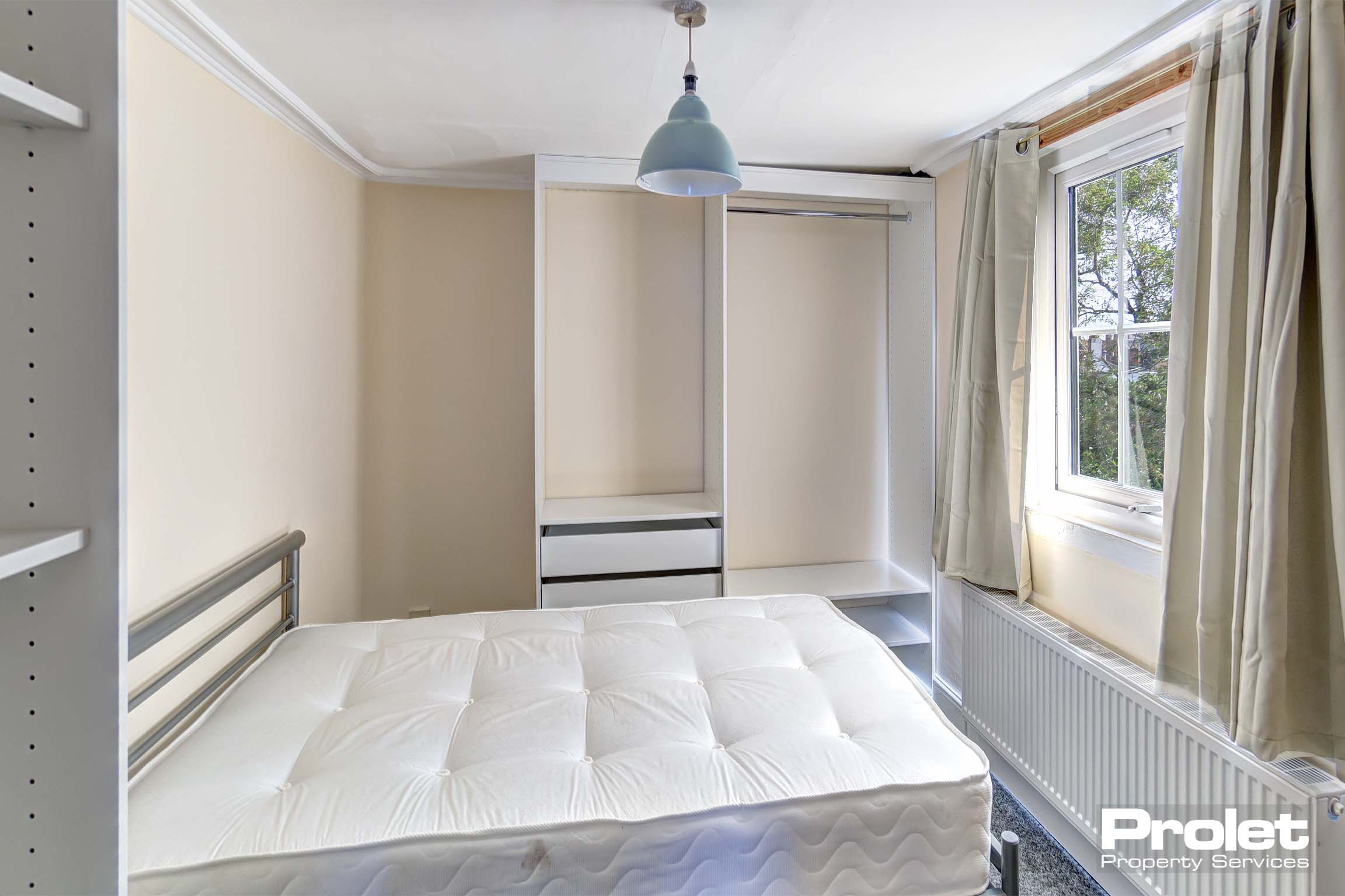 Double bedroom with built in furnishings