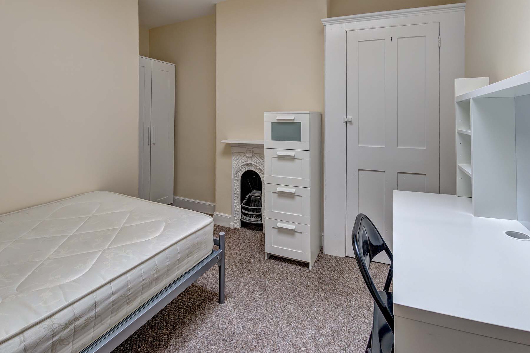 Bedroom with double bed, and white furnishings