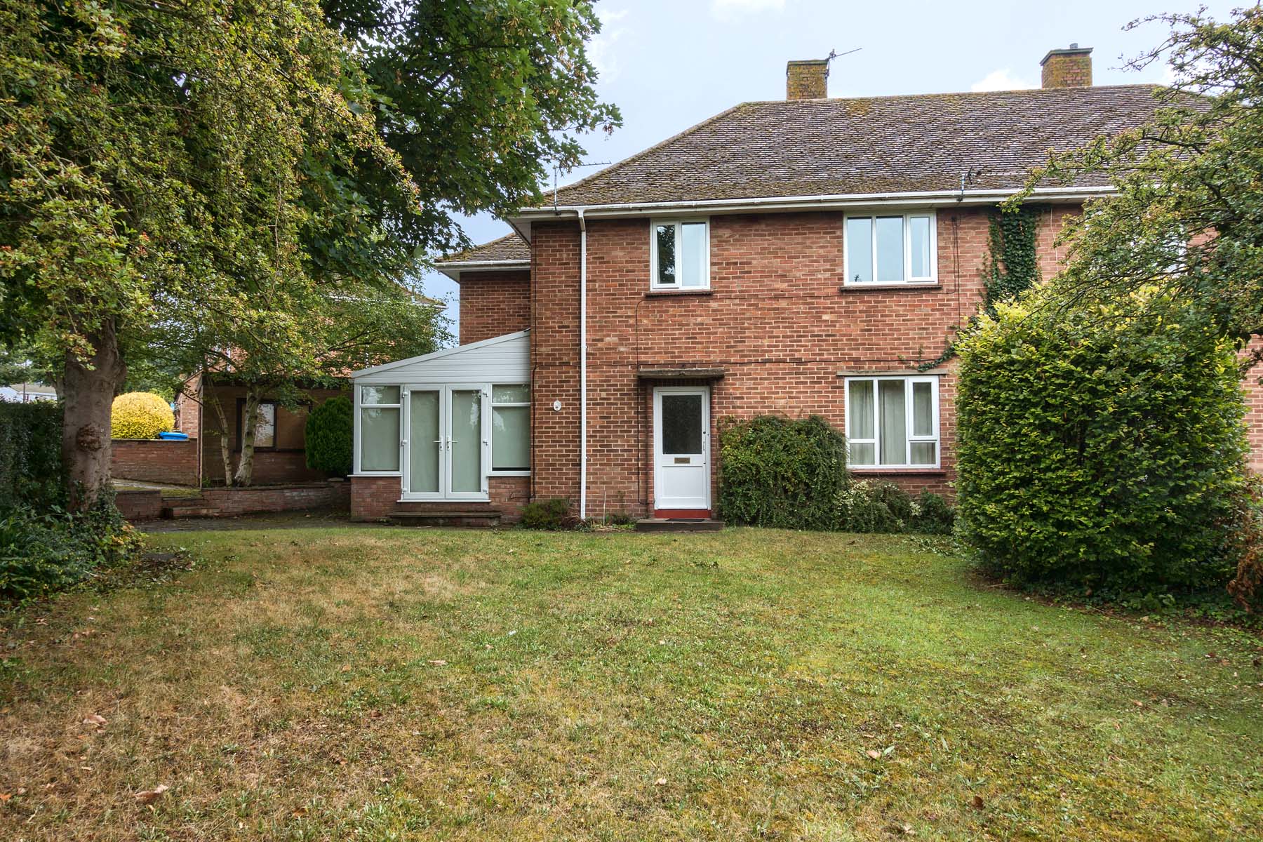 Brick house with large lawn