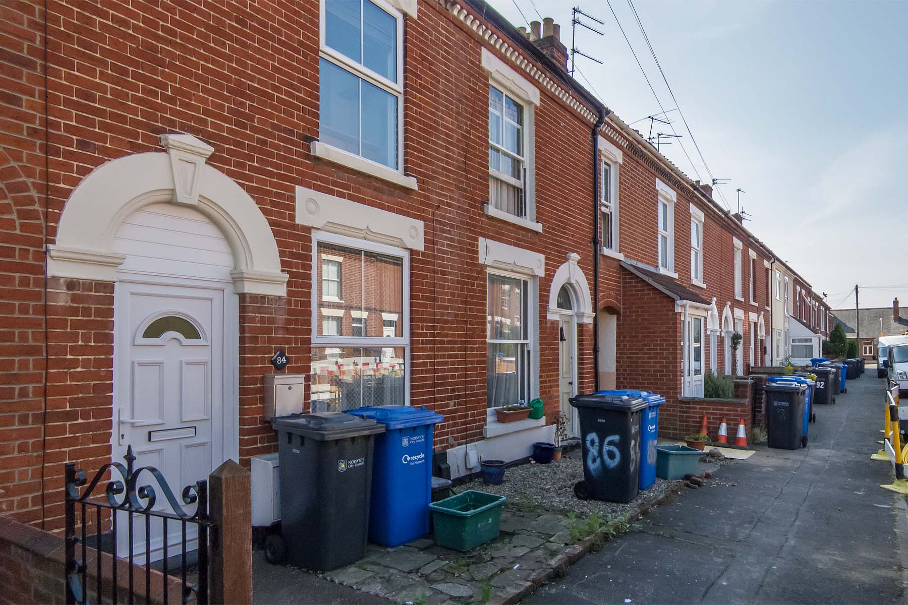 Terraced house with white front door.