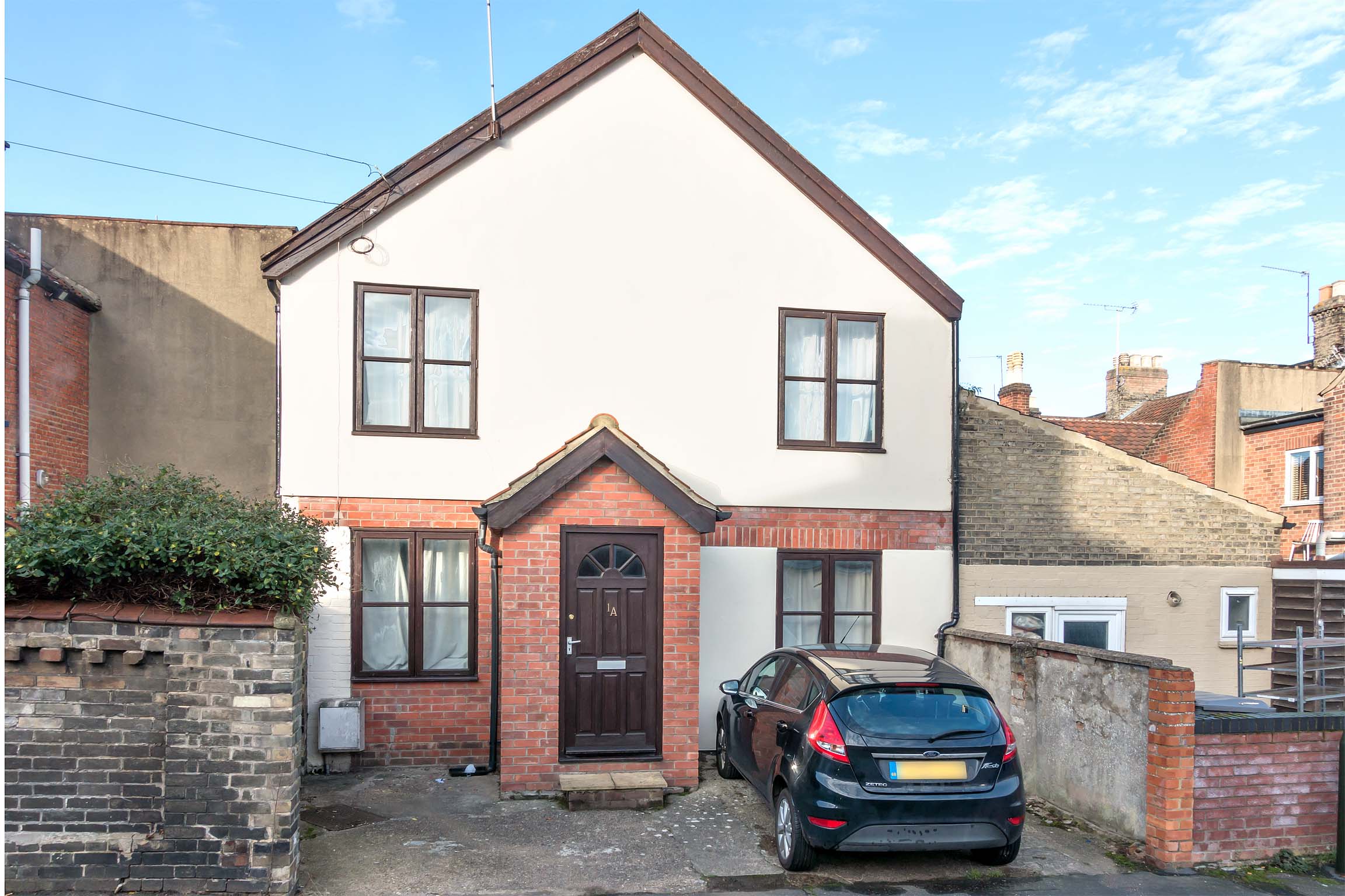Detached house with brick porch and small driveway
