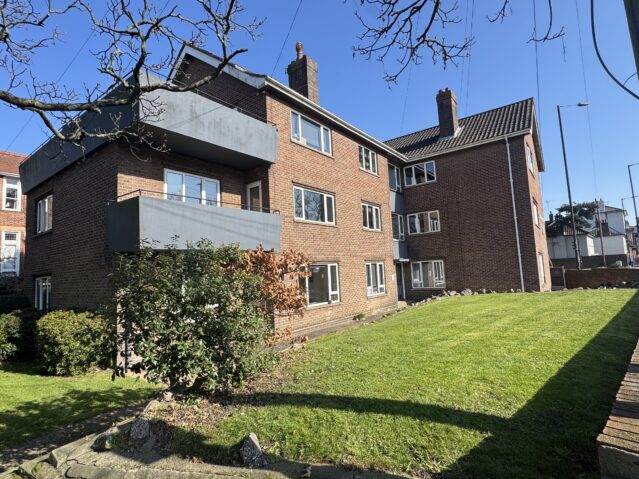 Side photo of chapelfield court, with lawn