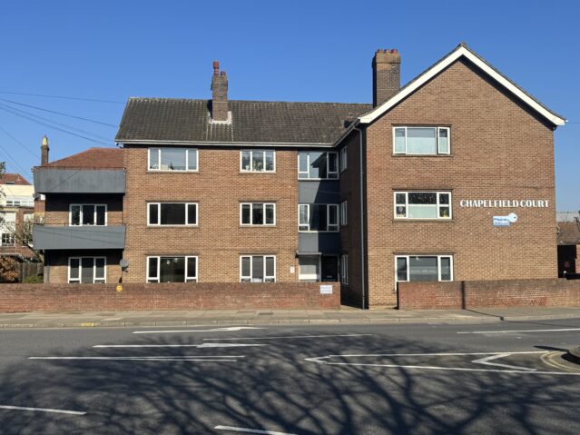 Exterior of chapelfield court, small block of flats on roundabout