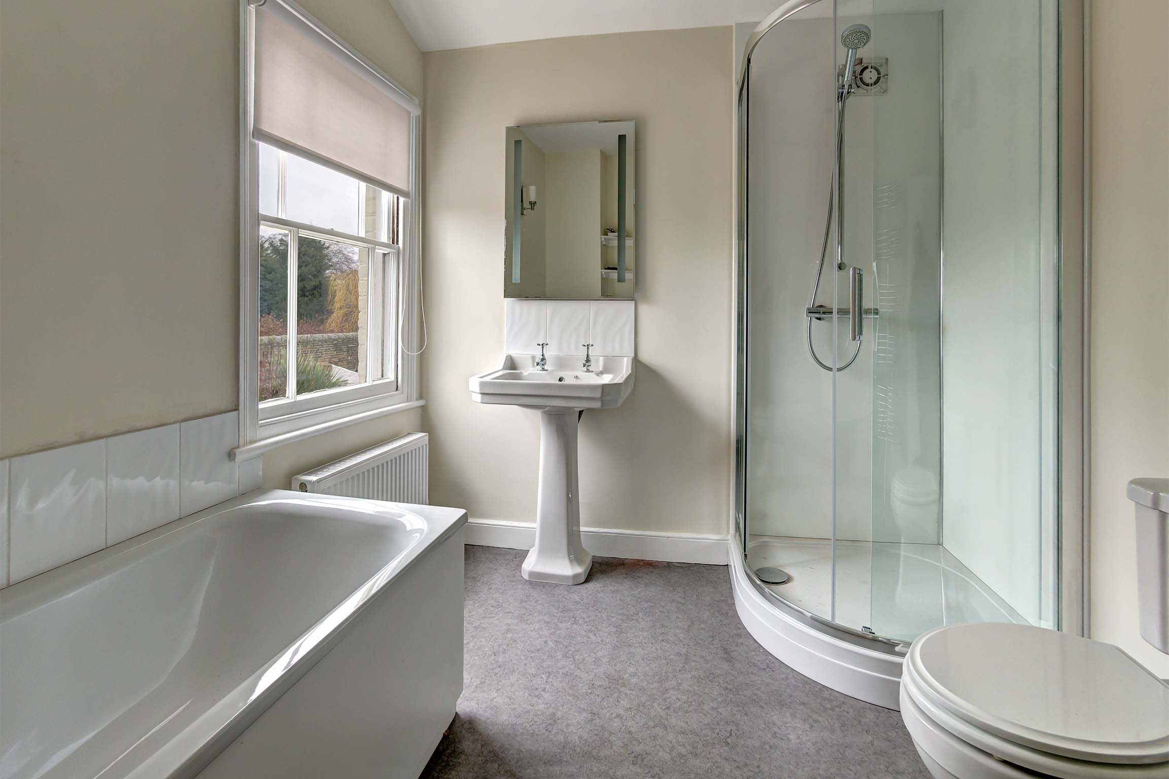 Bathroom with shower cubicle, toilert, bathtub, and sink