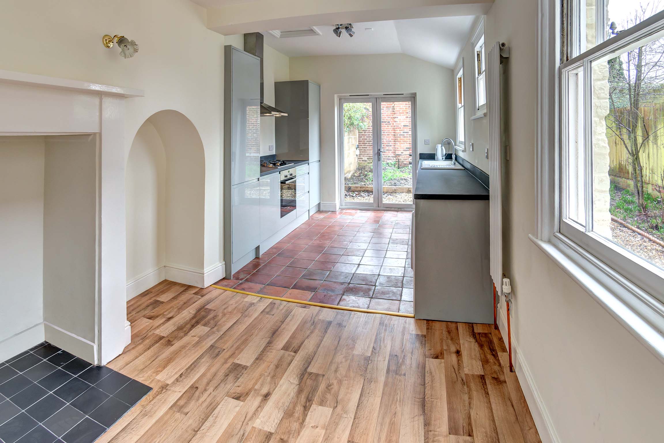 Kitchen with modern white cupboards and worktops