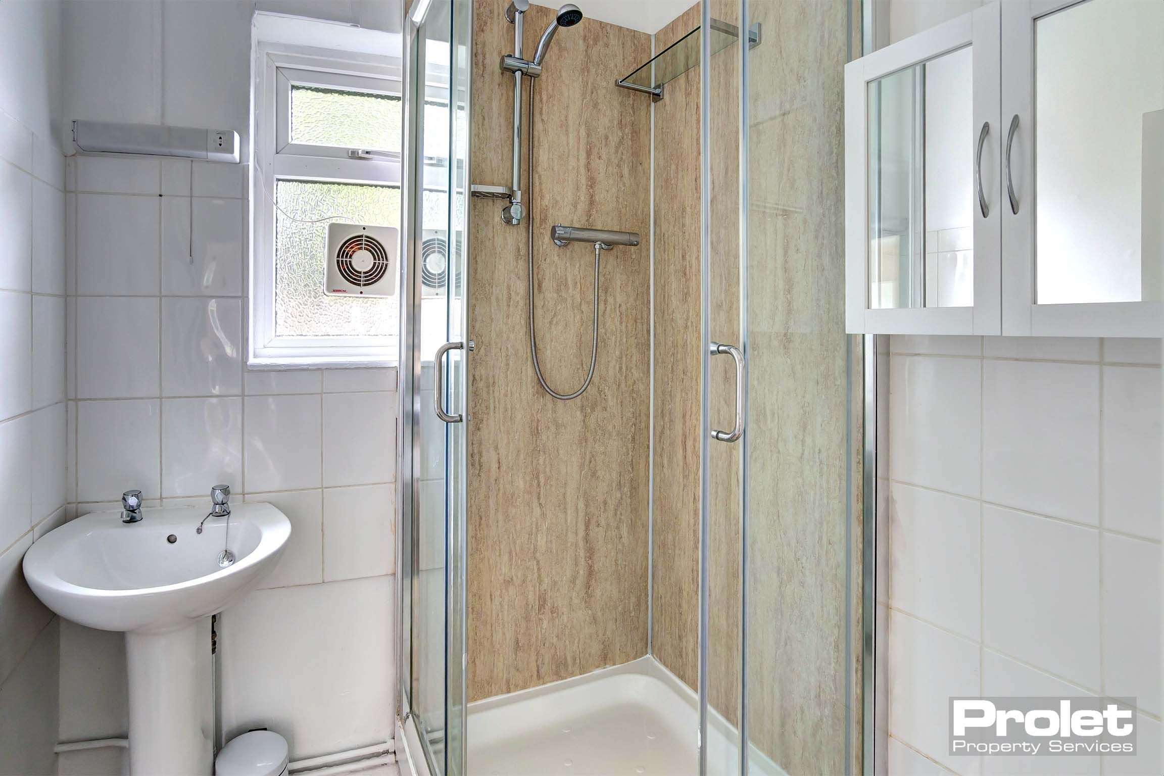 Bathroom with shower cubicle, and sink
