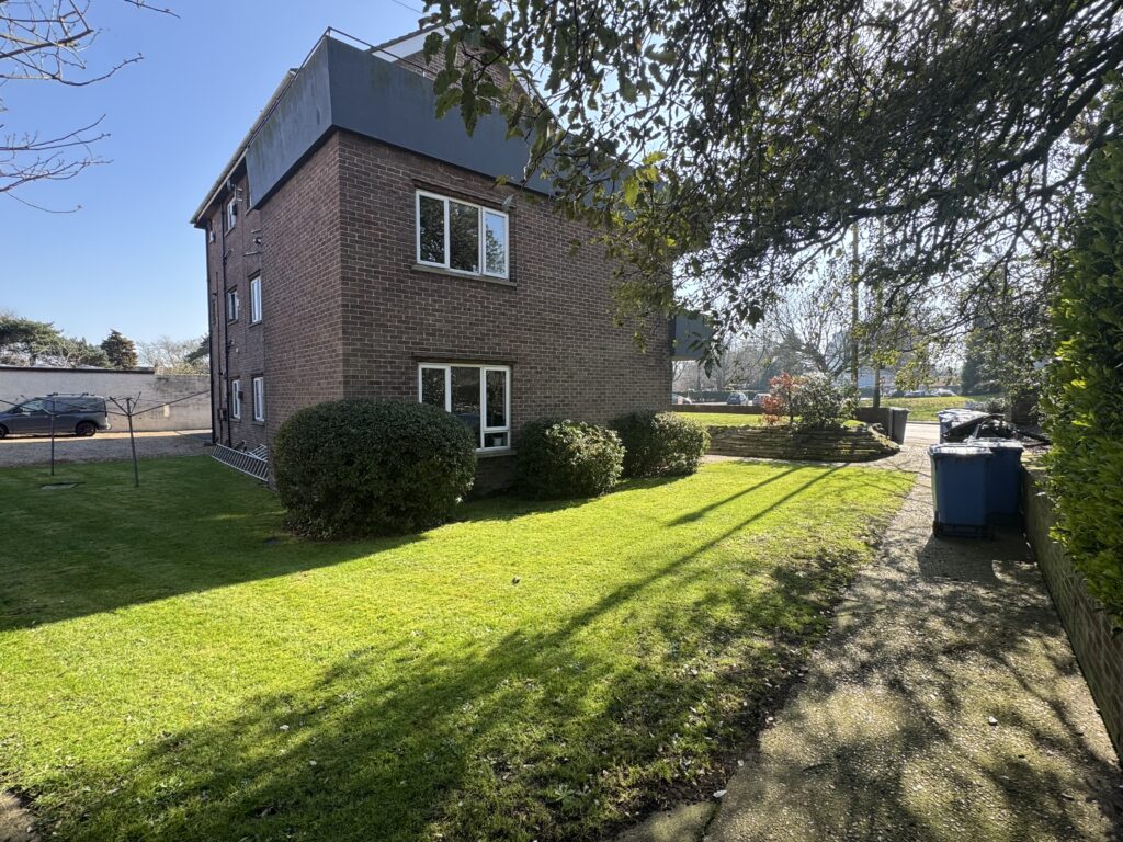 Rear photo of chapelfield court, with lawn