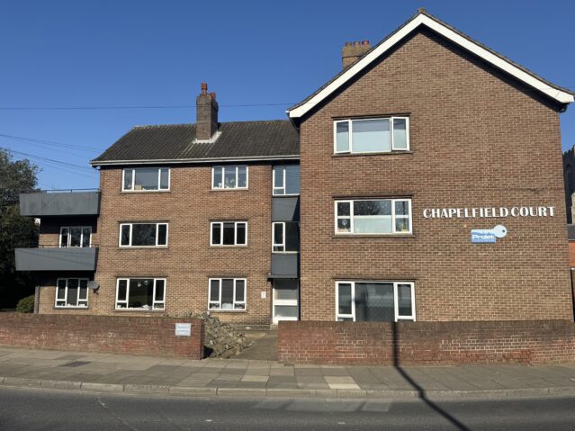 Exterior of chapelfield court, small block of flats on roundabout