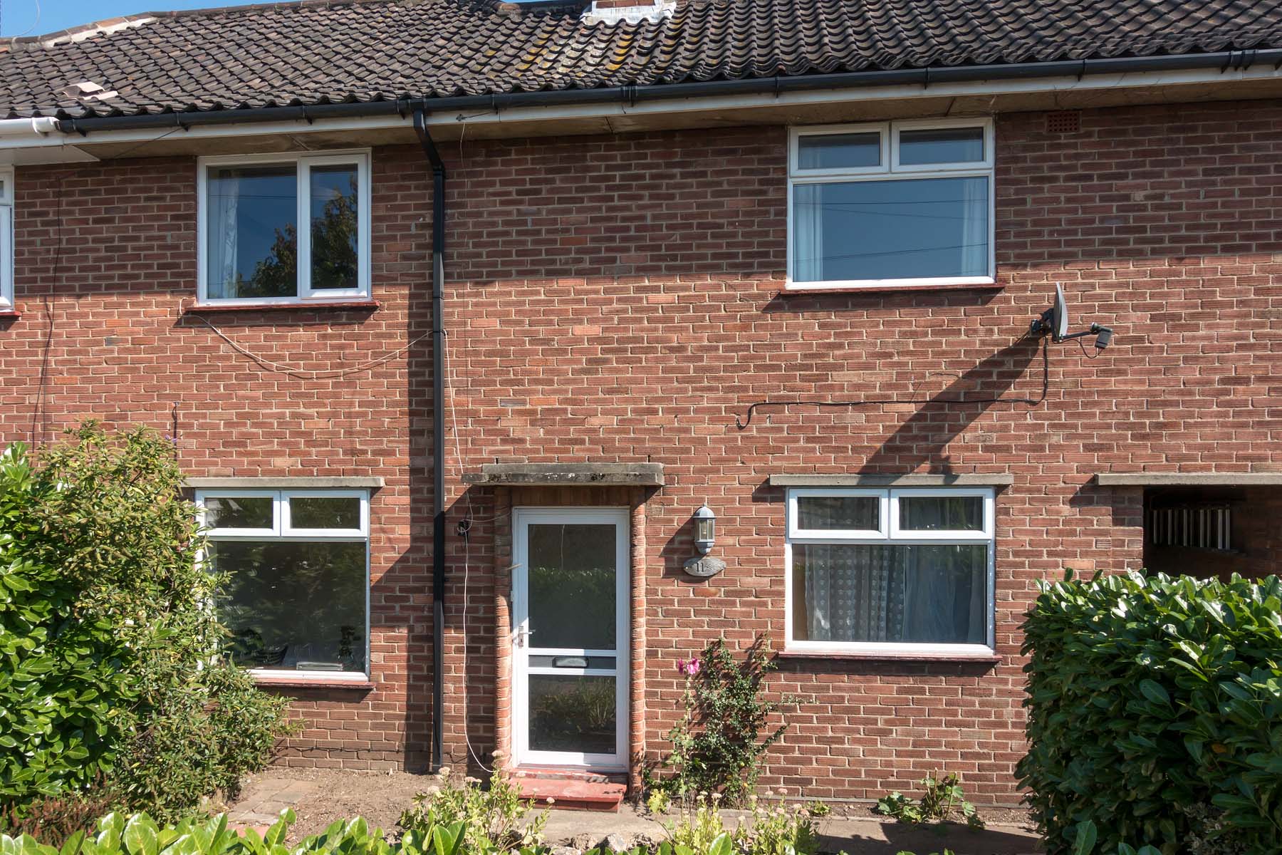 Brick house with white windows