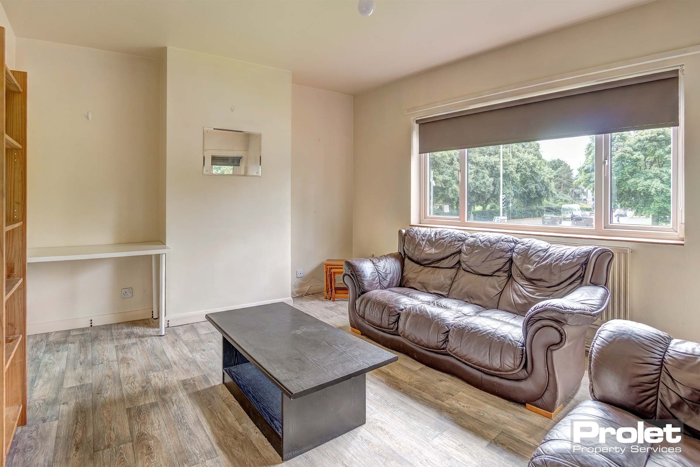 Living room with leather sofa and coffee table