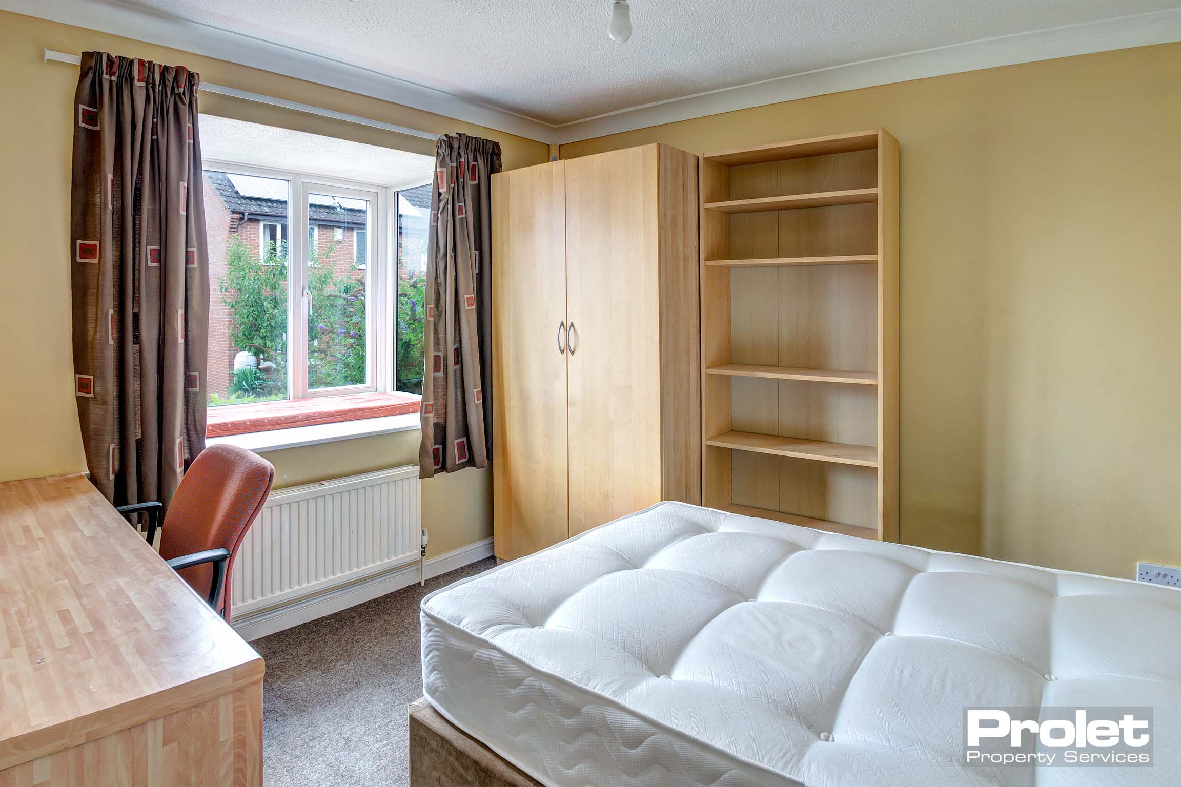 Bedroom with wooden wardrobe and shelves
