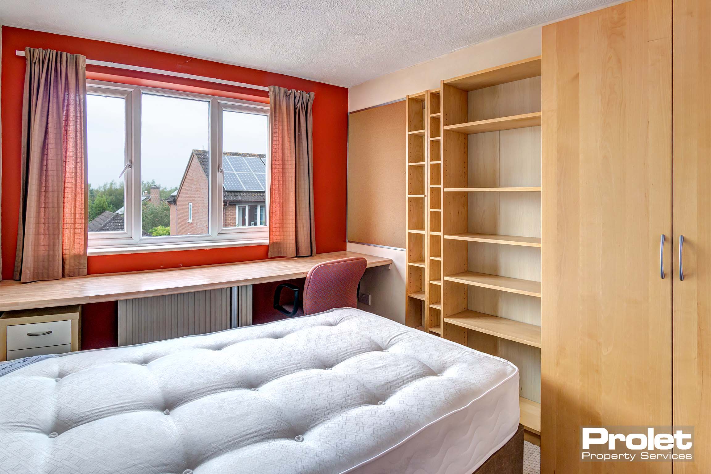 Bedroom with built in storage space