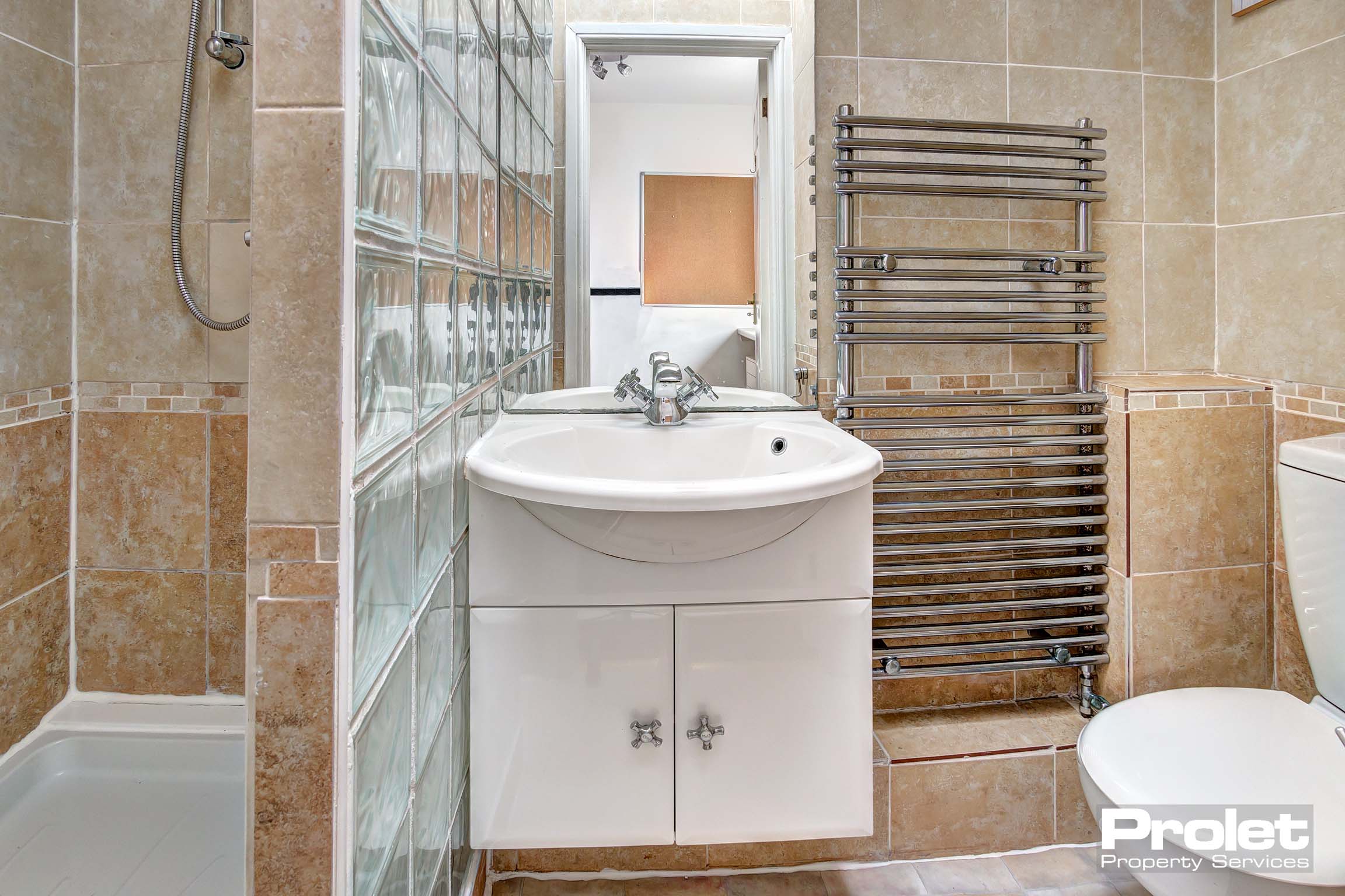 Bathroom with sink and walk in shower