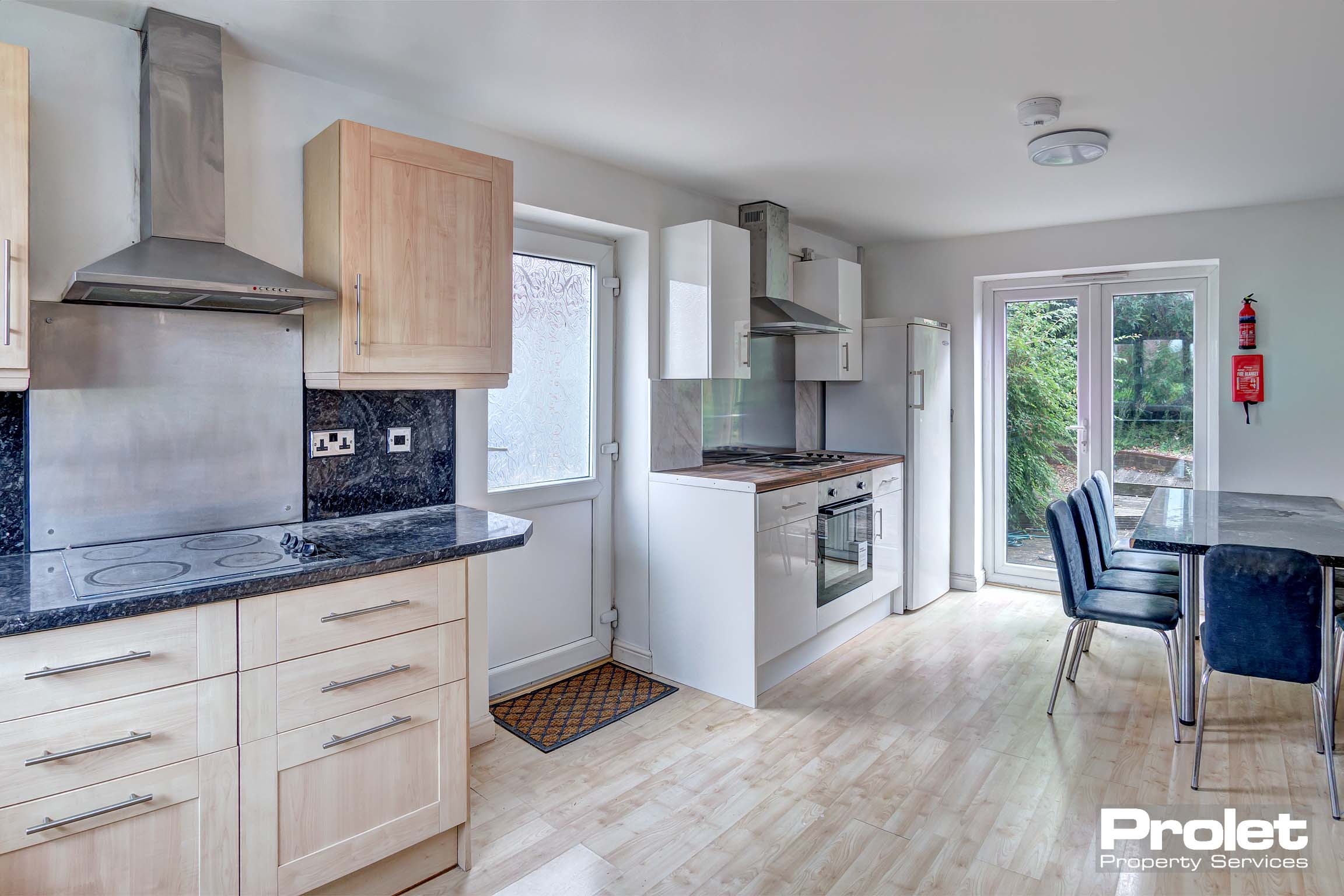 Kitchen with dining table and patio doors