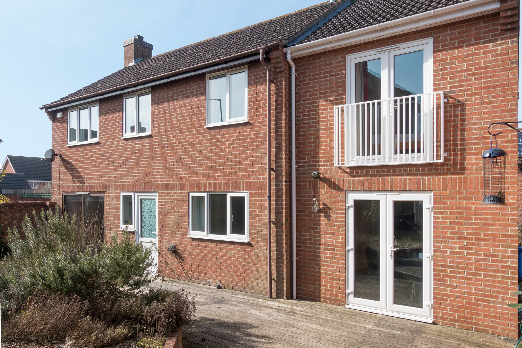 Rear view of house with patio doors and patio area