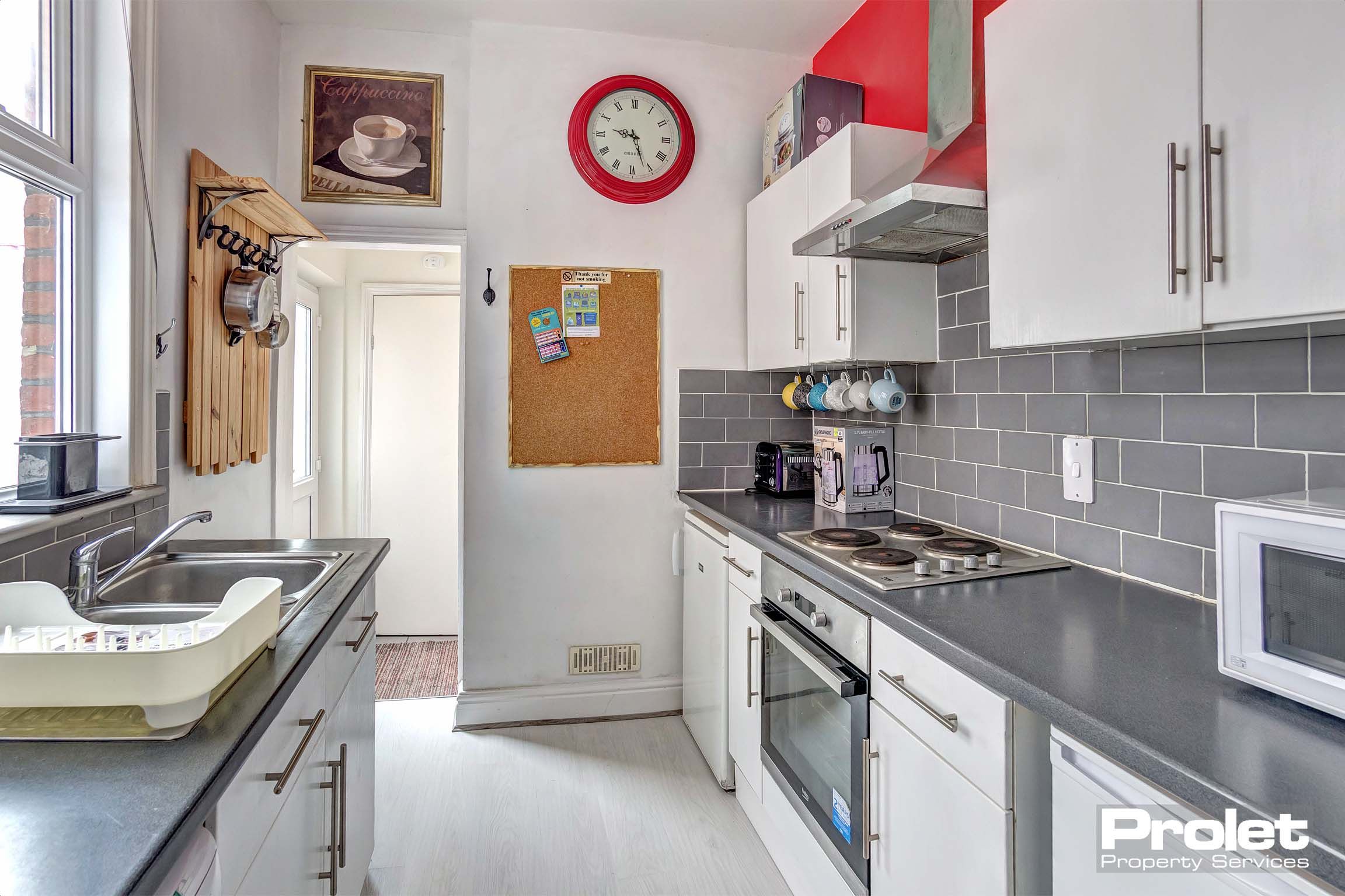 Galley style fitted kitchen with lino flooring