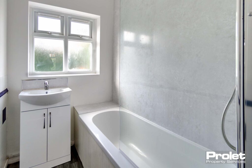 Bathroom with shower over bath