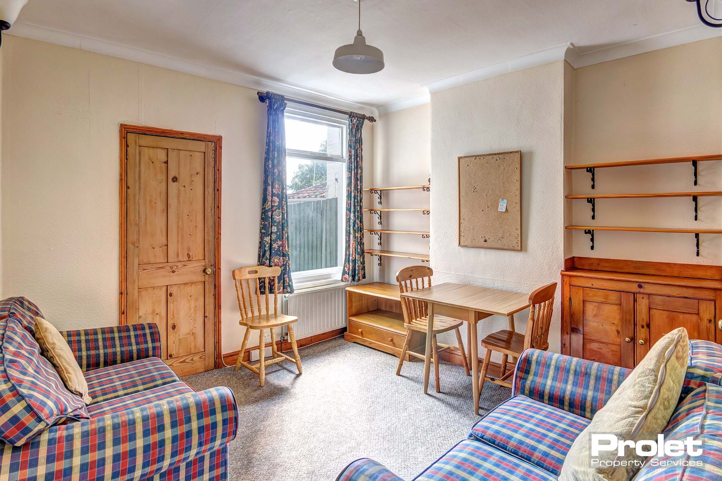 Living room with sofas and dining table set