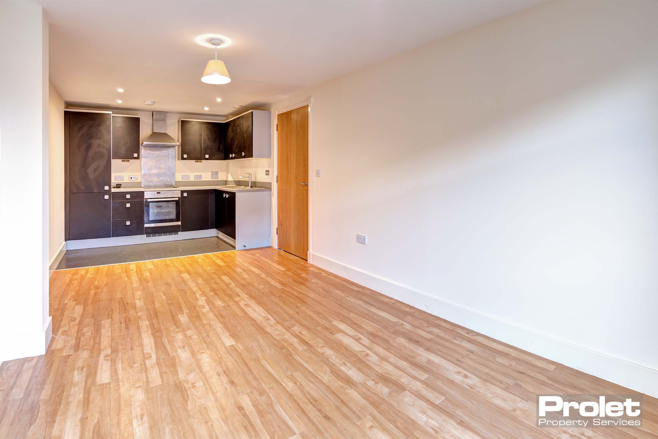 Magnolia walls and laminate flooring to kicthen