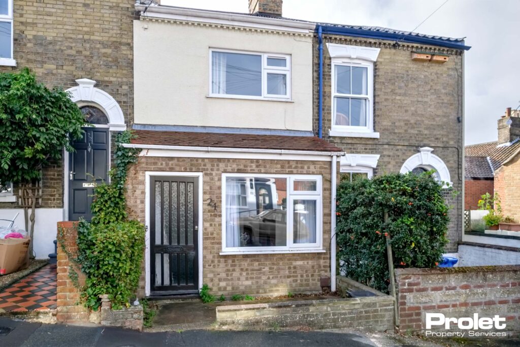 Terraced house with porch and wooden door