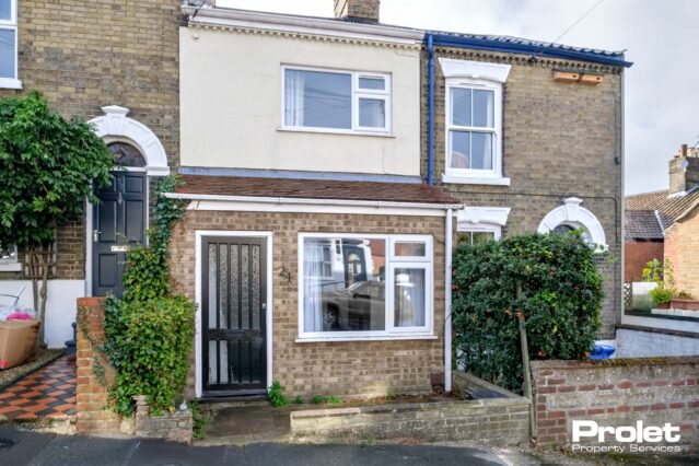 Terraced house with porch and wooden door