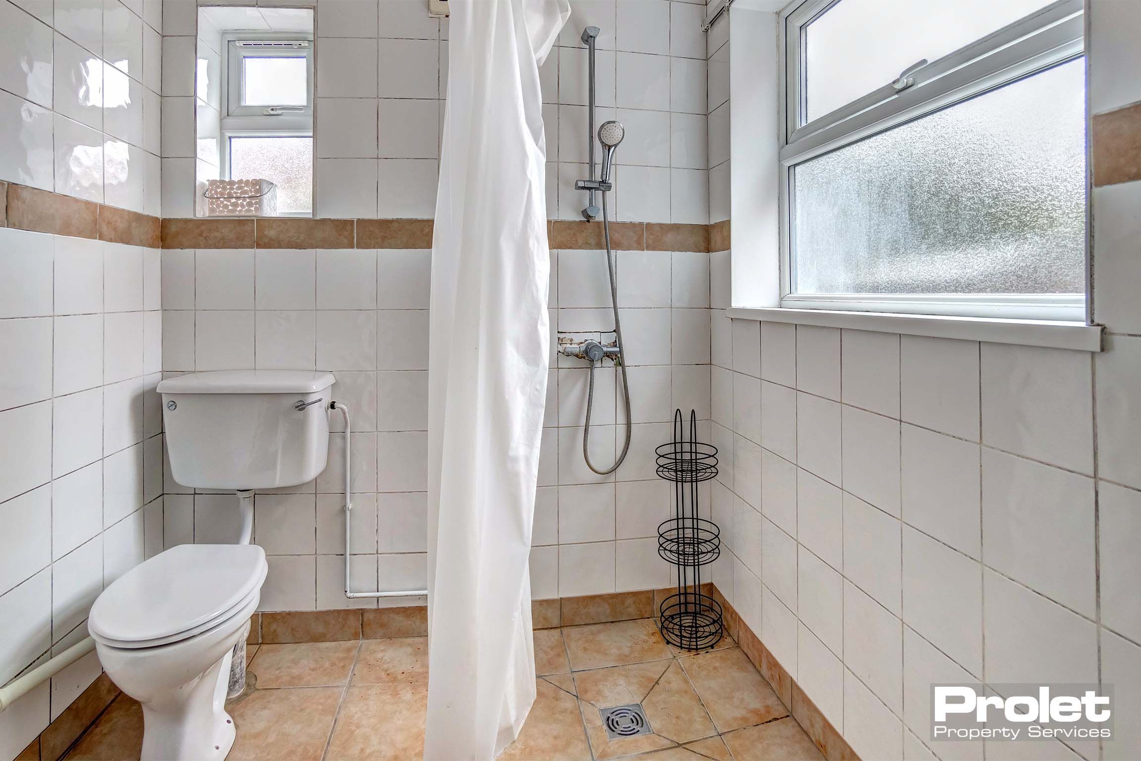 Wet room with toilet and shower