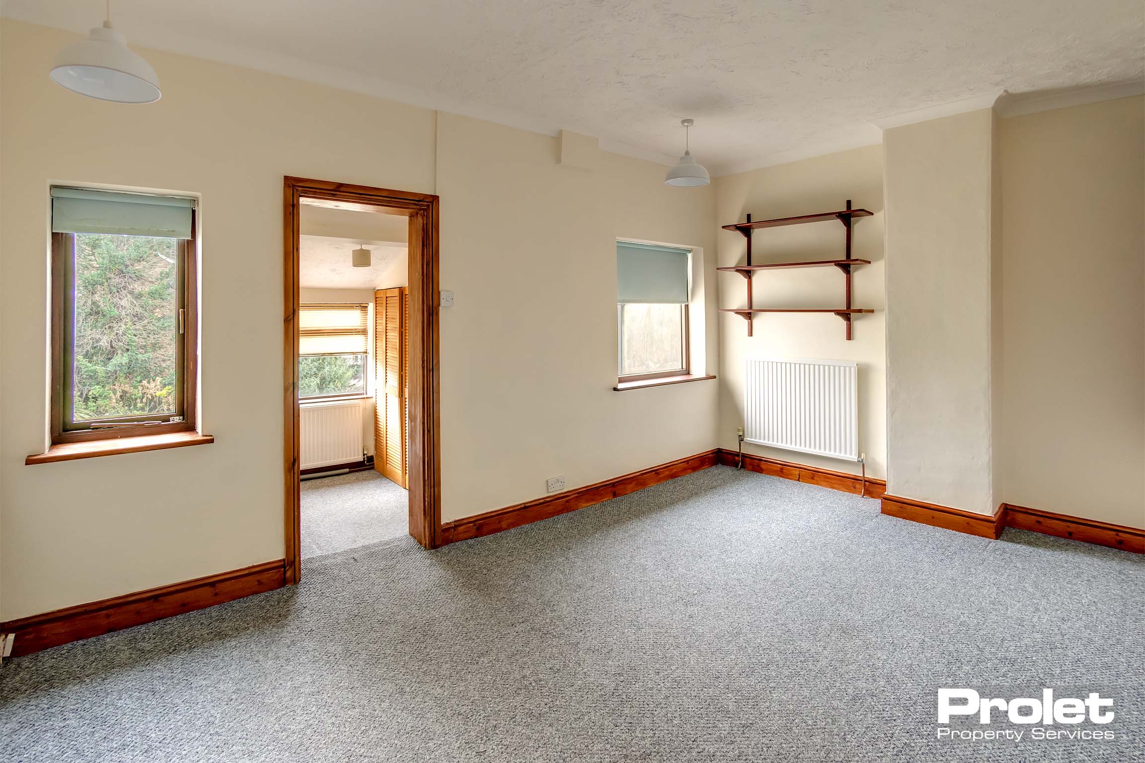 Grey carpets and magnolia walls