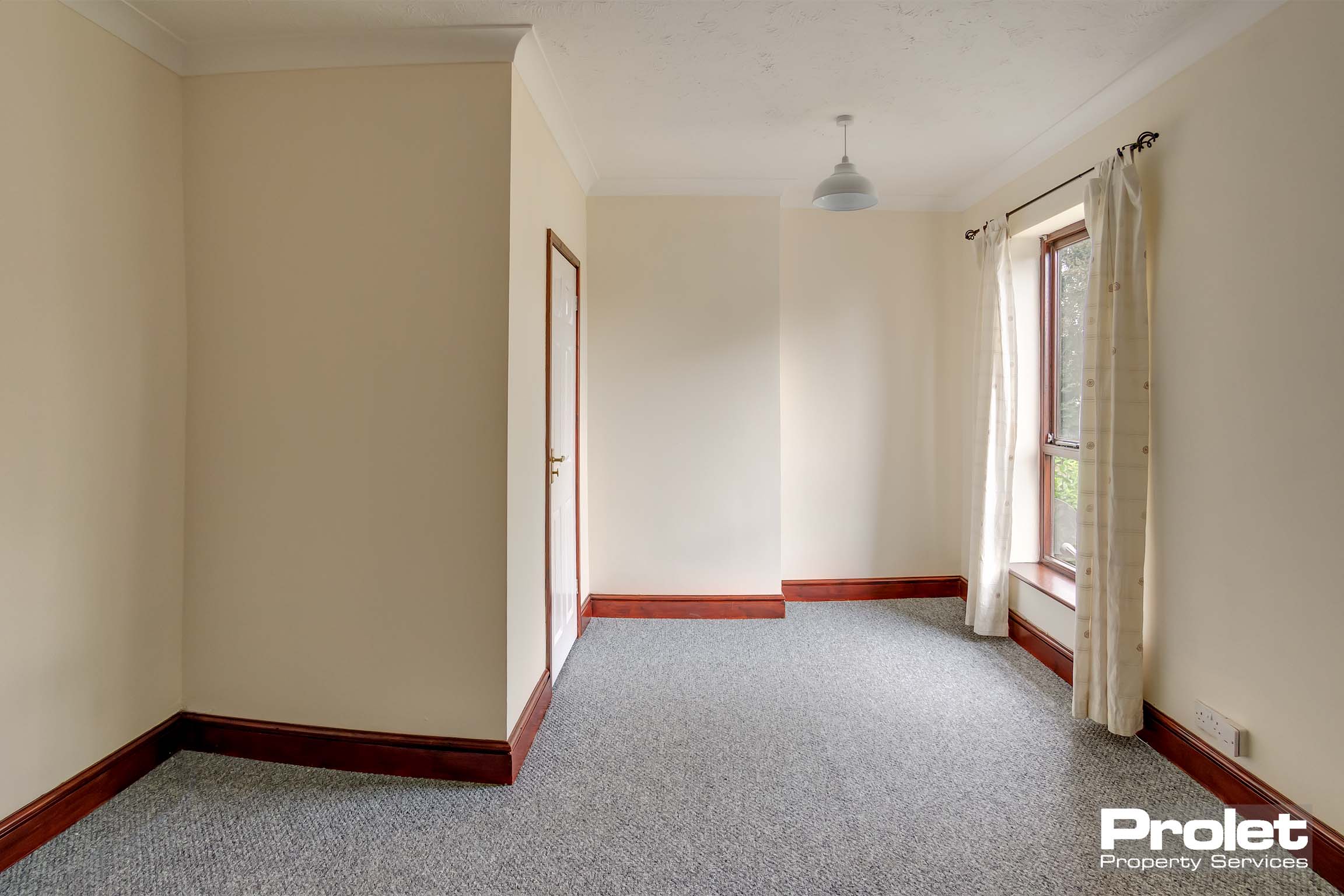 Grey carpets and magnolia walls