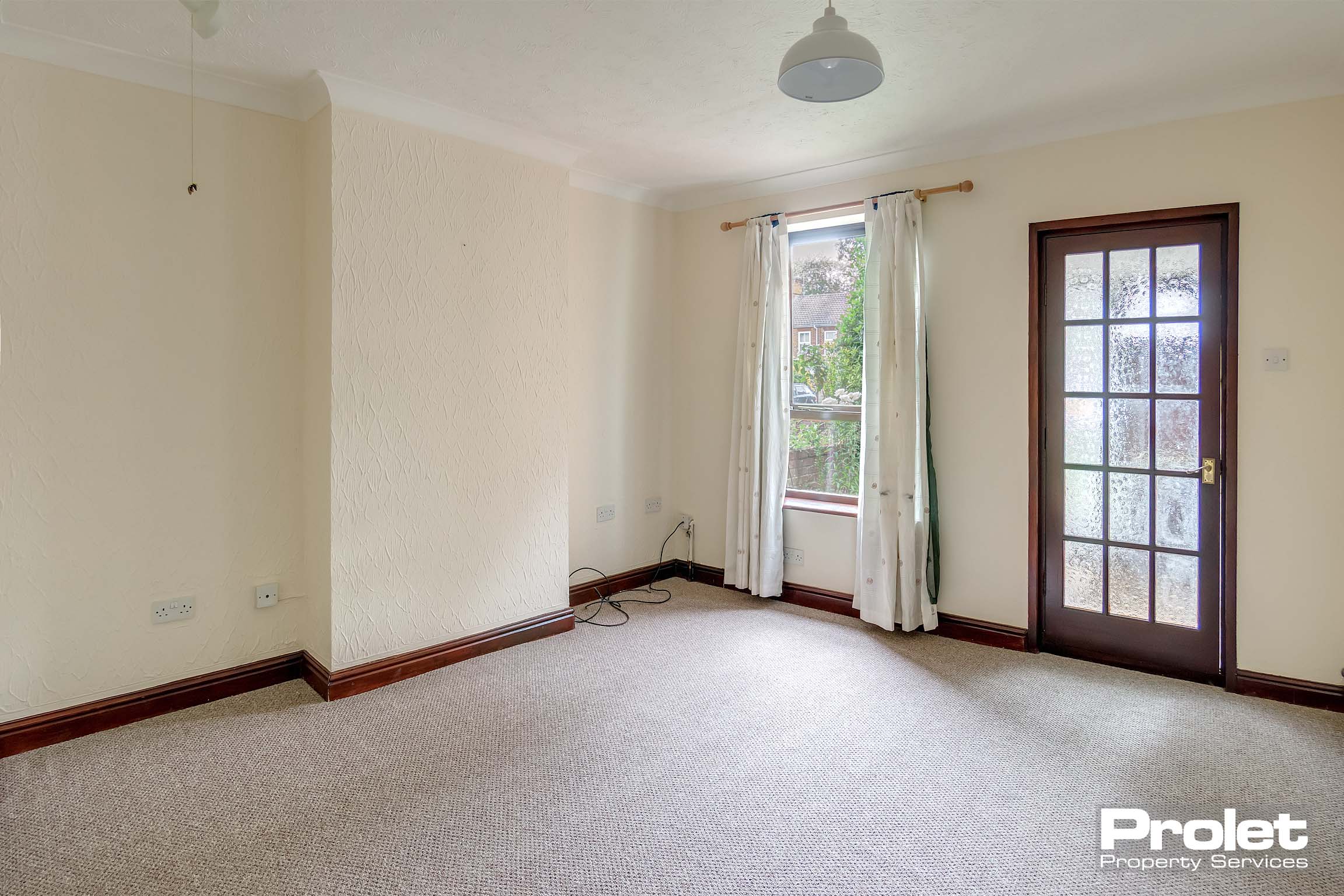 Brown carpet and magnolia walls