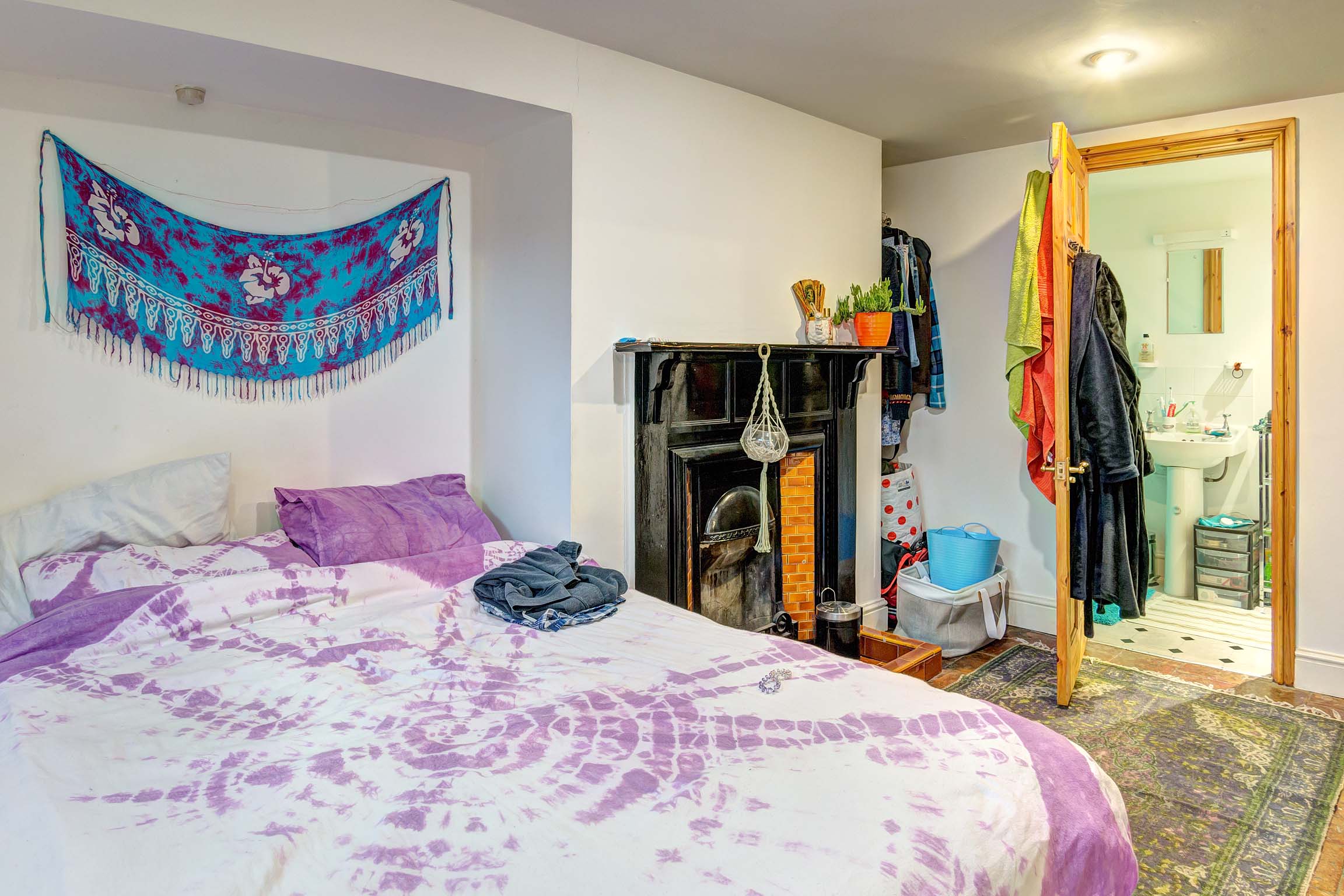Bedroom with double bed and period fireplace
