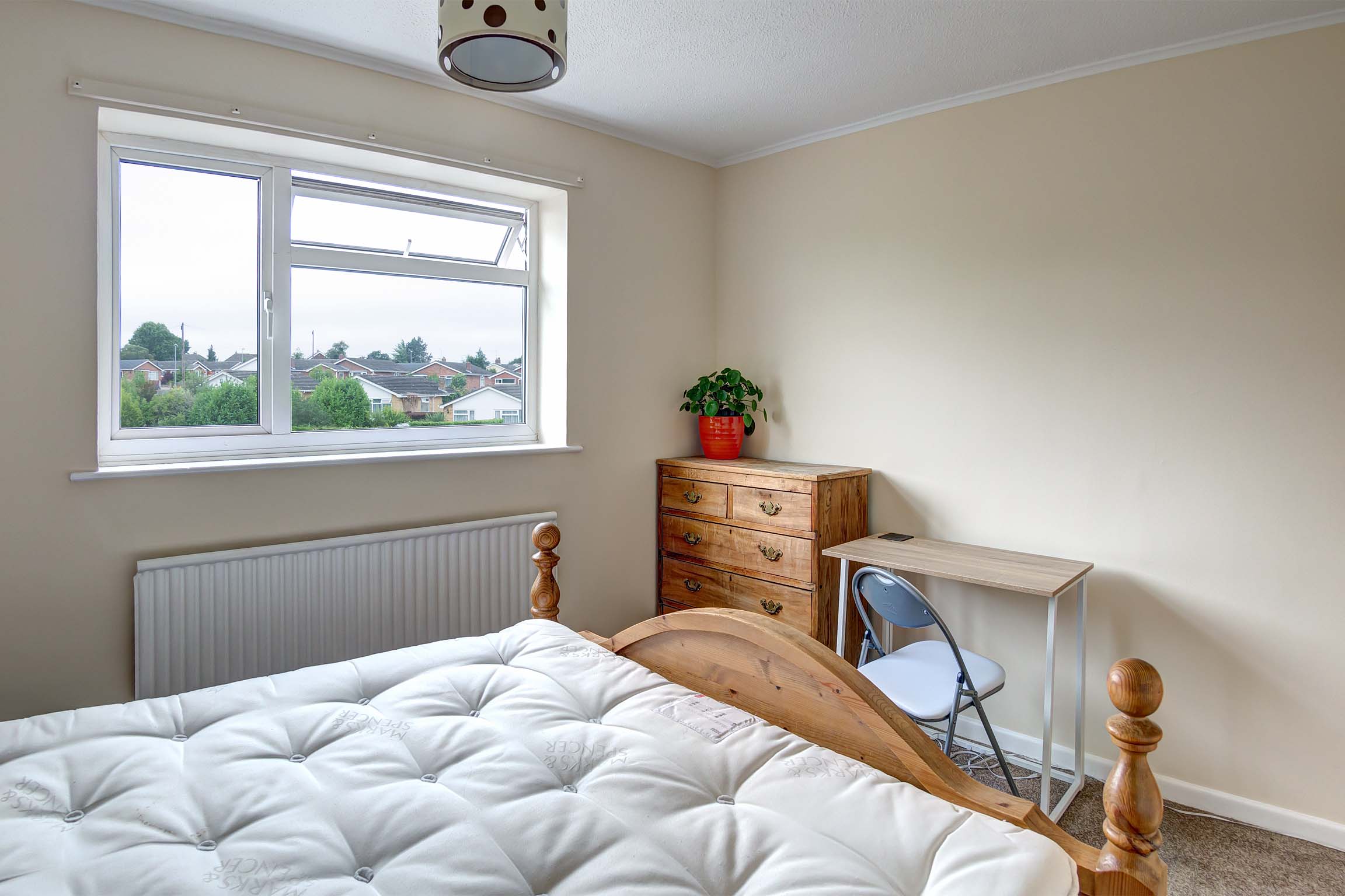 Bedroom with double bed, and desk