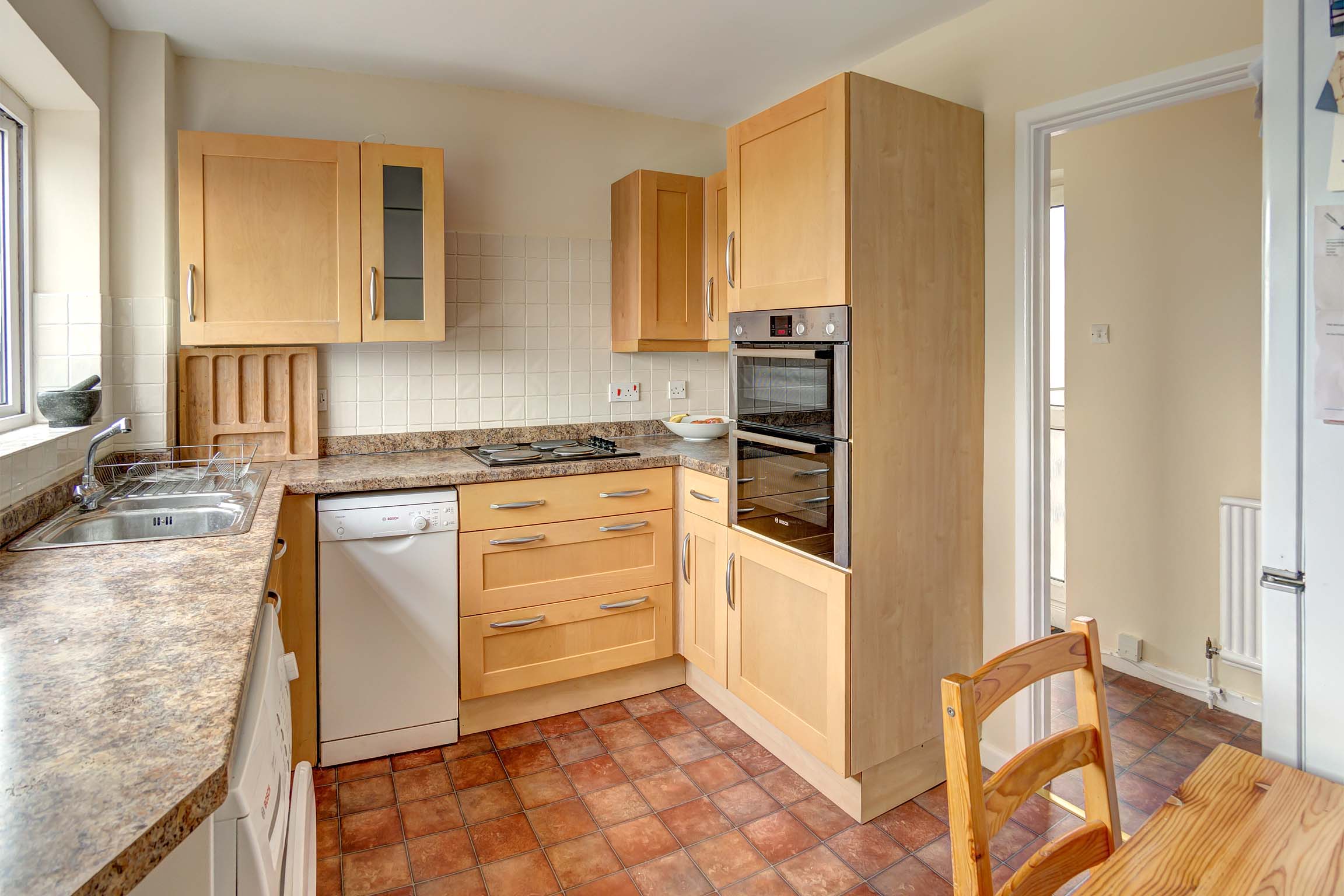 Kitchen with white goods and wood effect fittings