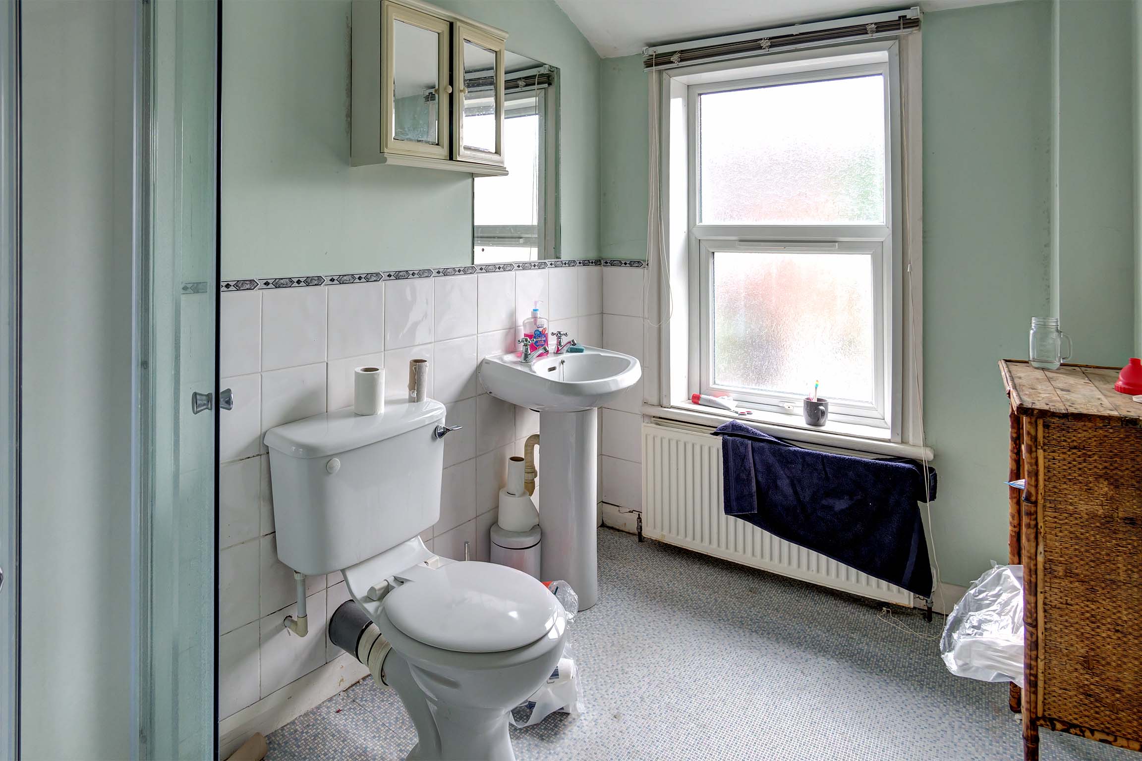 En-suite bathroom with shower cubicle, toilet, and sink