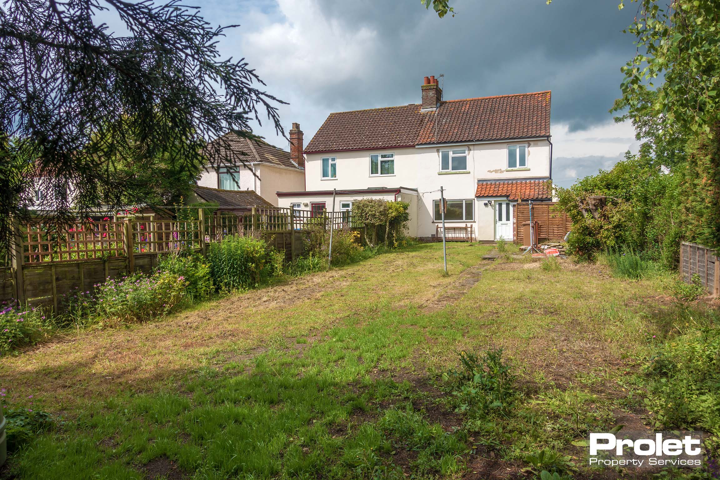 Property from rear, large garden set to lawn