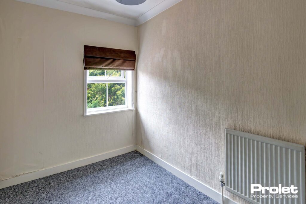 Grey carpet with white painted walls