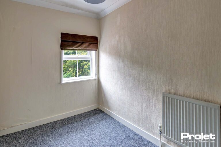 Grey carpet with white painted walls