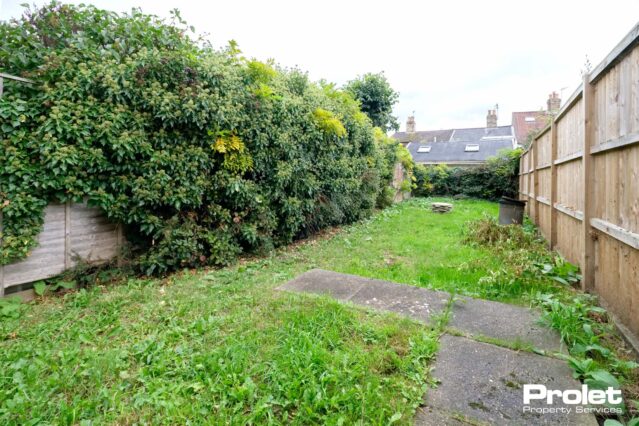 Rear garden, laid to lawn with hedges