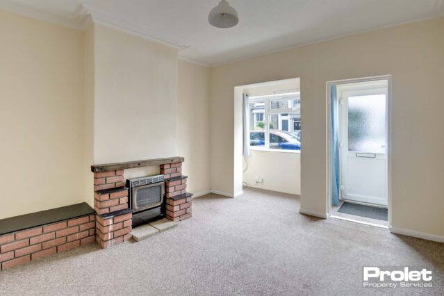 Large lounge with porch area and brick effect fixtures