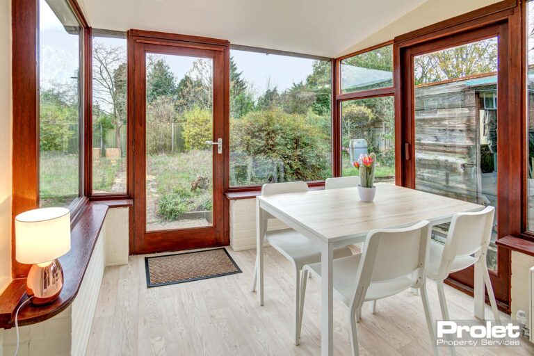 Conservatory dining area with table and chairs