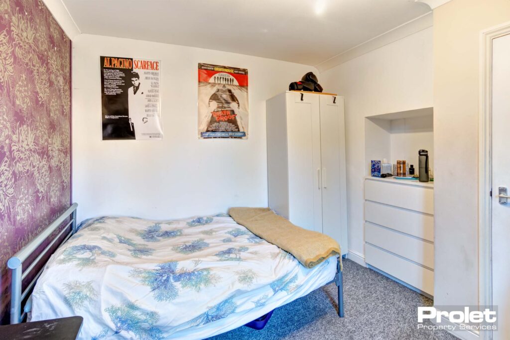Large downstairs double bedroom with white wardrobe and chest of drawers