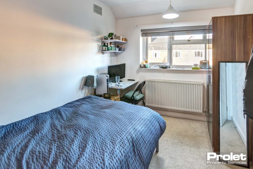 Upstairs double bedroom with desk and wardrobe