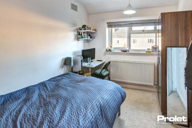 Upstairs double bedroom with desk and wardrobe