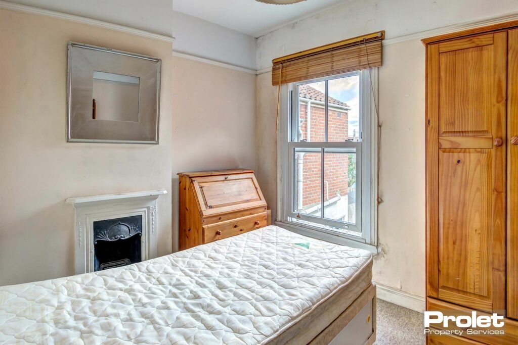 Double bedroom with wooden writing desk