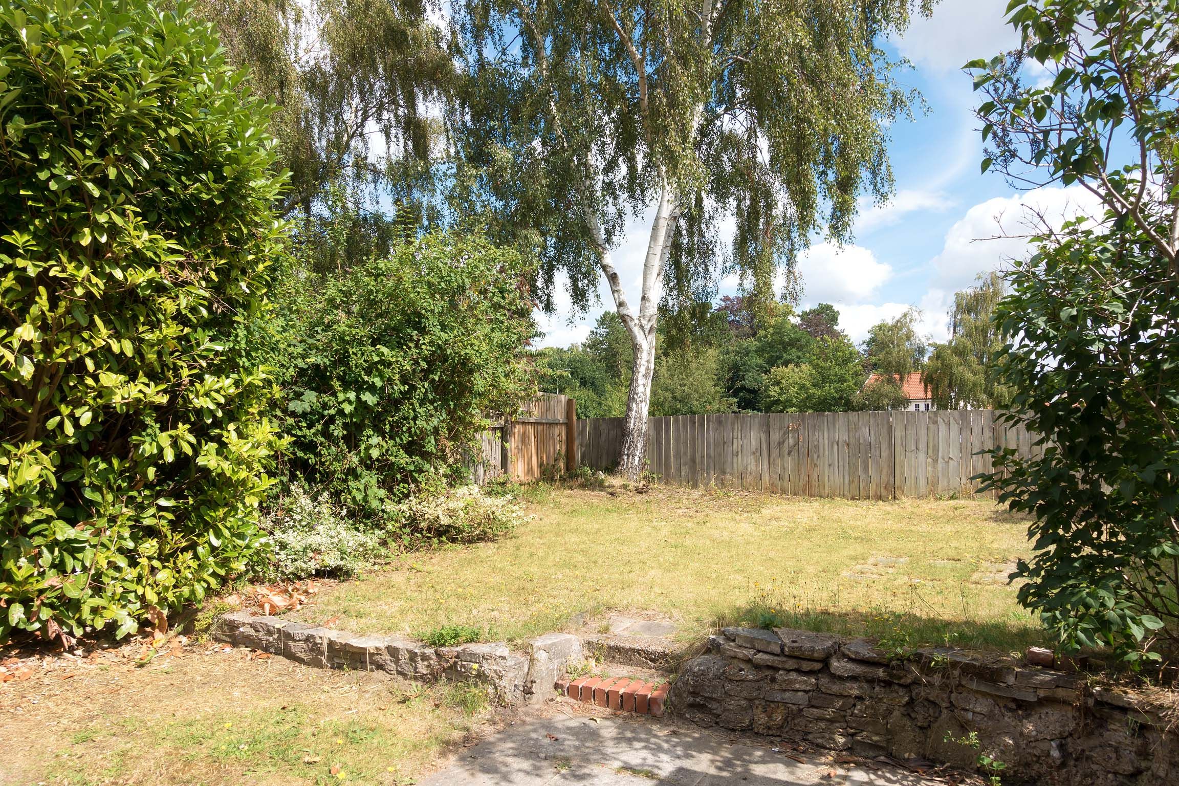 Large back garden with lawn